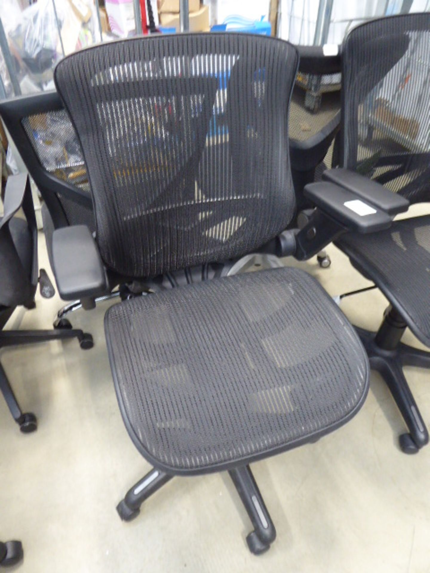 Black mesh swivel armchair