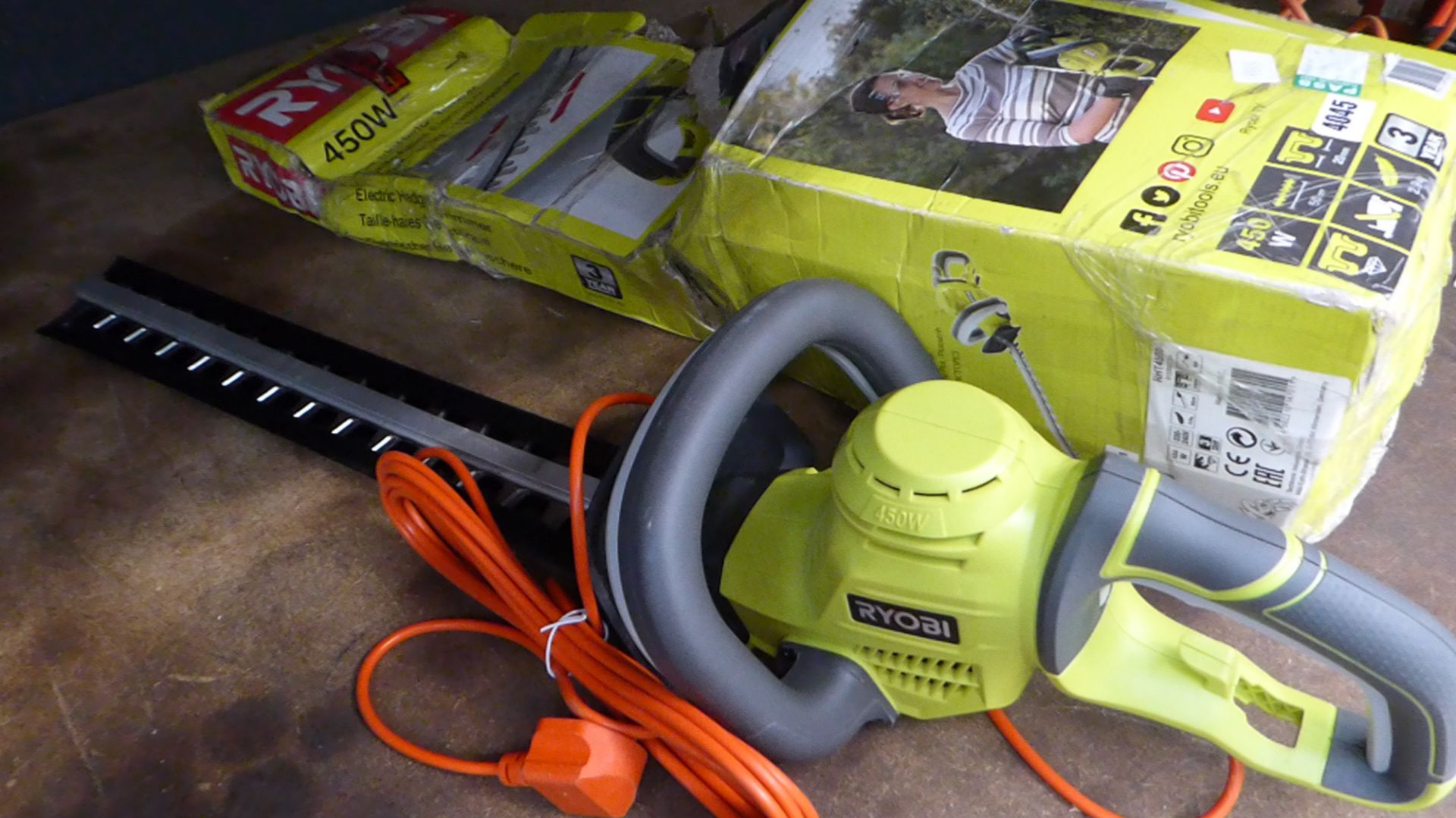 Ryobi boxed electric hedge cutter and hand saw