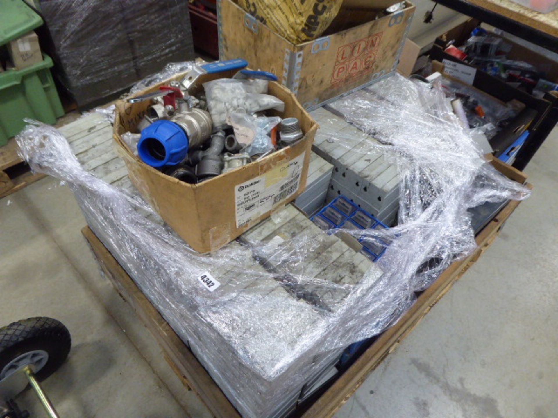 Large pallet of assorted parts boxes including screws, washers, nails, bolts plumbing valves,