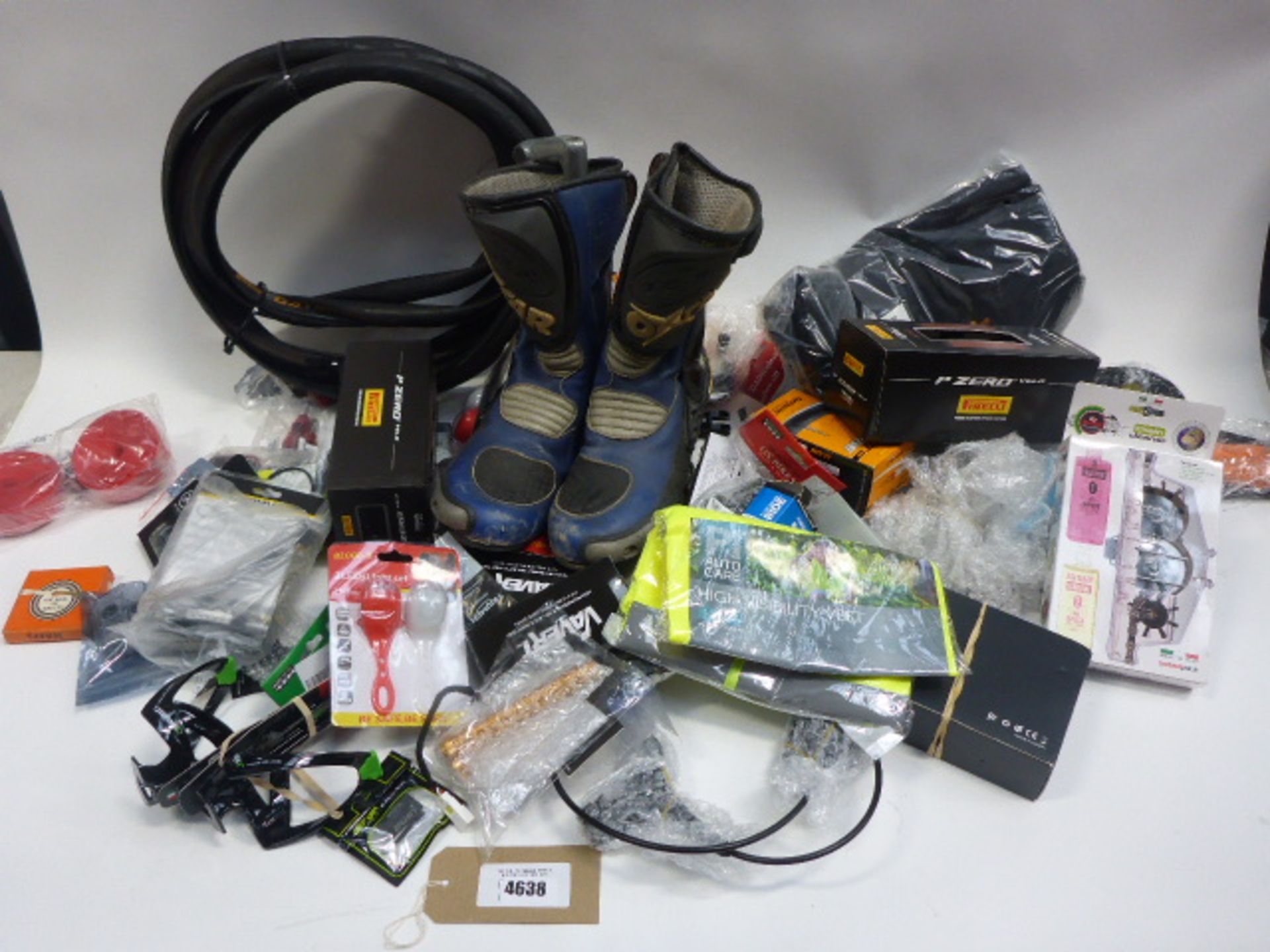 Bag containing bike/motorbike parts and accessories including inner tubes, boots, tyres, chain