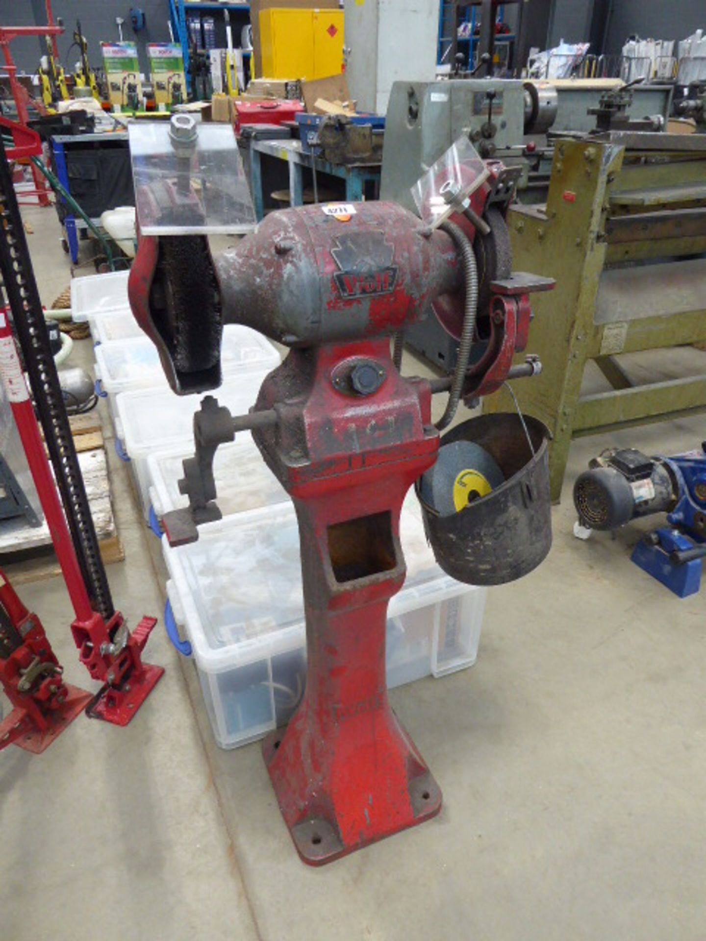 A Wolf bench grinder and wire brush on pedestal