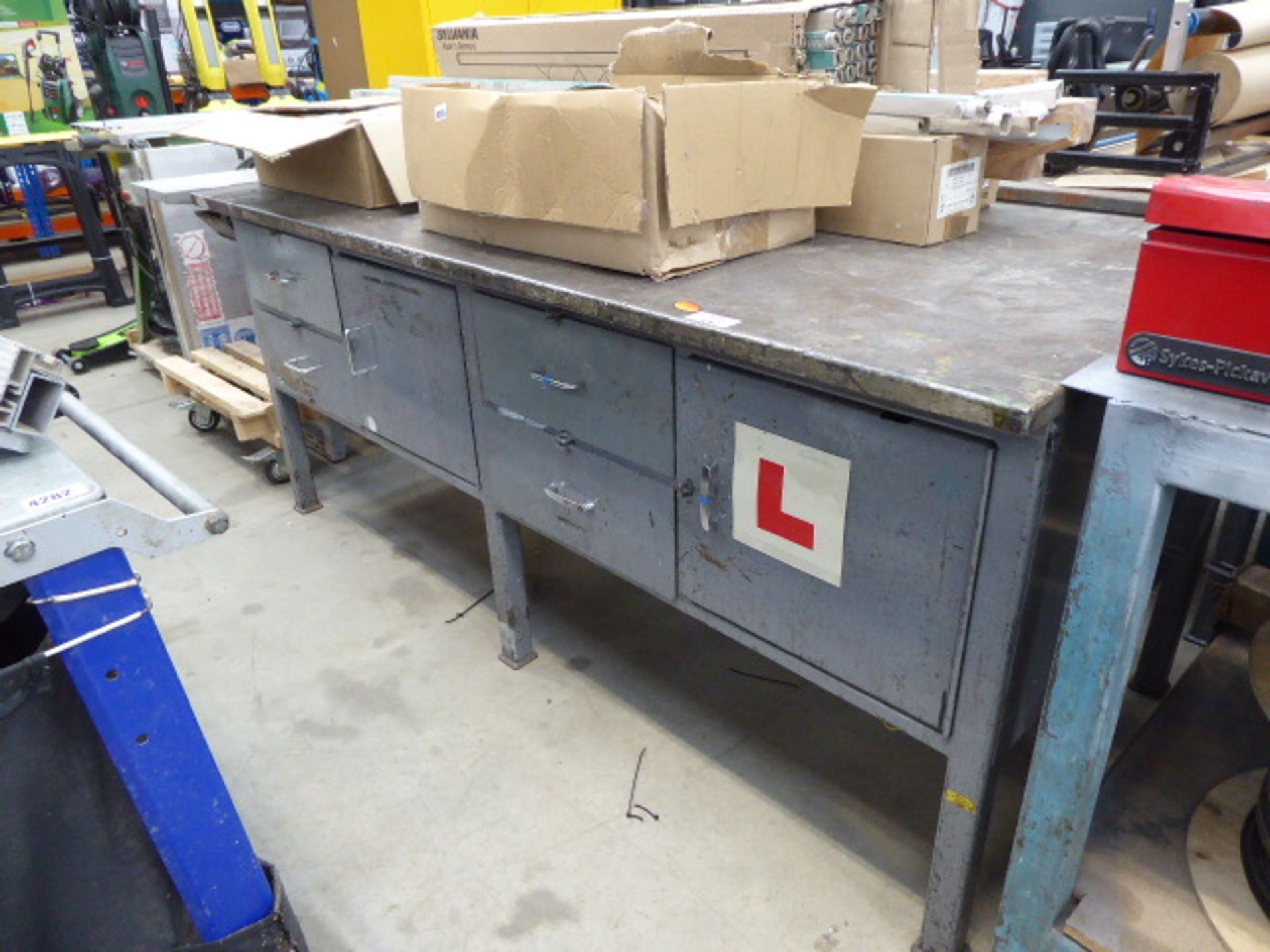 Large metal framed, metal topped work bench with drawers and cupboards under
