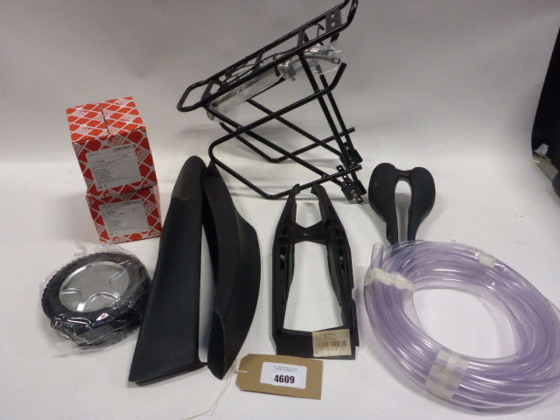 Bag containing: bike rack, bike seat, aniti-roll bar bushes, wheel and vehicle trim parts