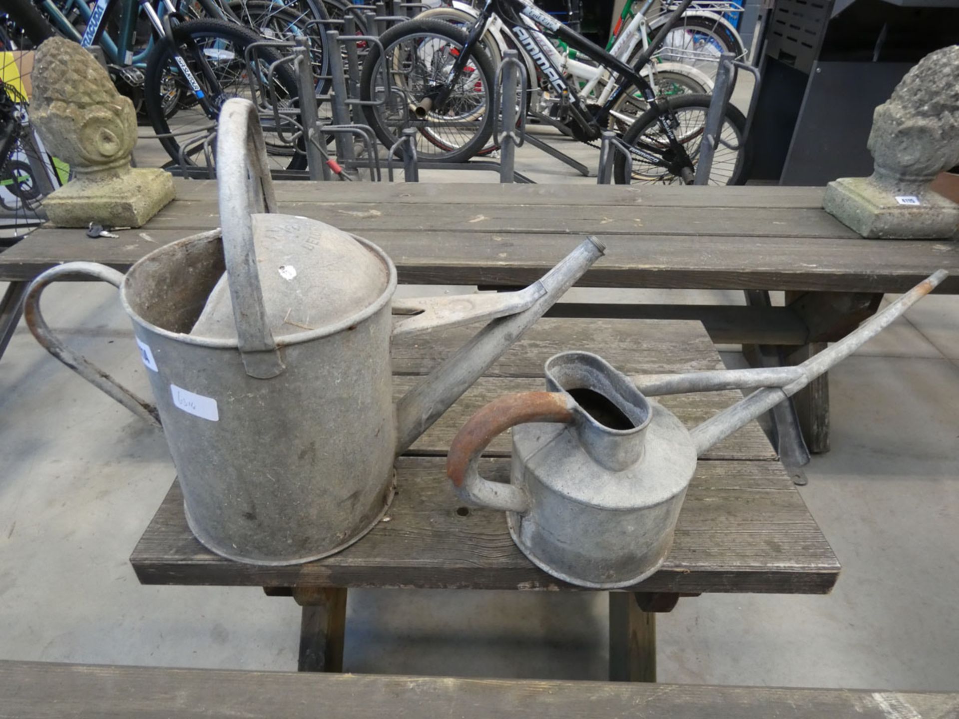 2 galvanized watering cans