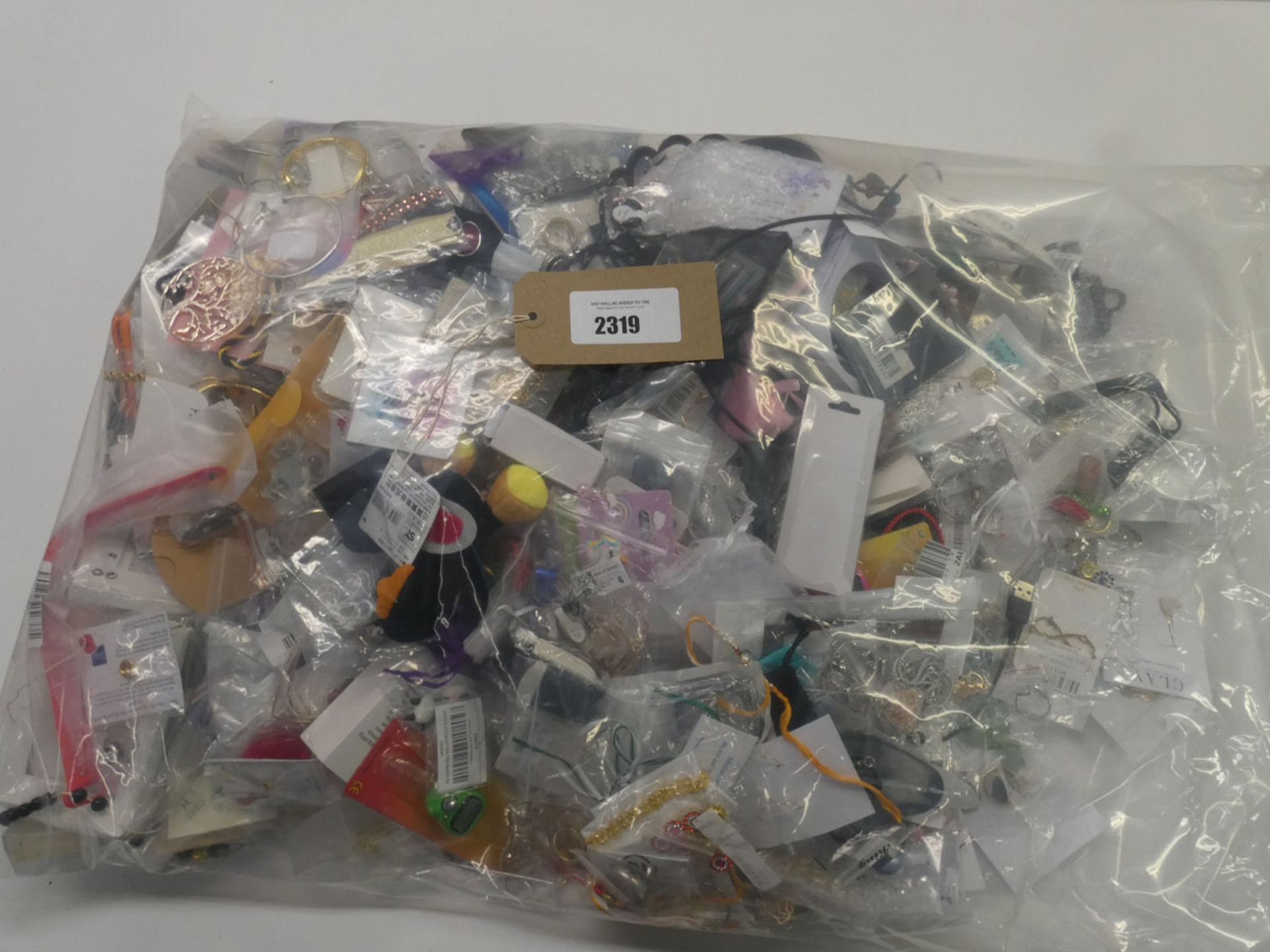 Bag containing quantity of loose costume and dress jewellery