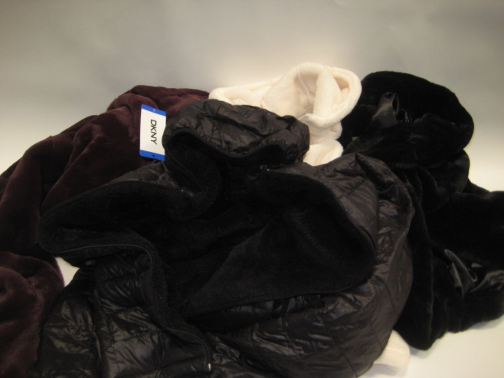 4 ladies coats, 1 by DKNY, 2 by Andrew Marc and 1 by 32 Degree Heat (3 are faux fur, 1 faux fur