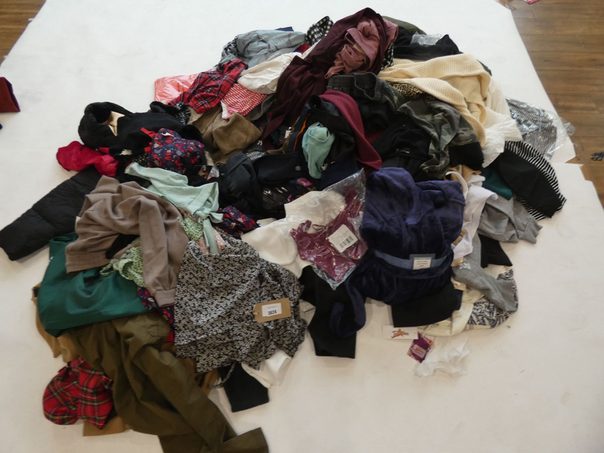 Half a stillage of ladies and men's clothing