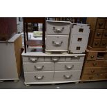 Cream painted part bedroom suite comprising 2 chests of drawers and 2 drawer bedside cabinet