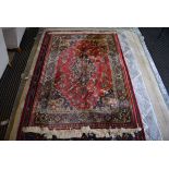 5347 - Red ground floral patterned rug