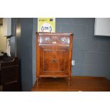 A reproduction yew finish bedside cabinet