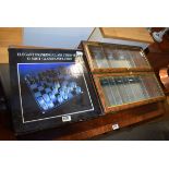 Boxed glass chess set drinking game and a small yew finished display case Completeness of chess