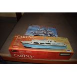 2 boxed model kits of the Cutty Sark and a cabin cruiser