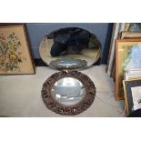 Plaster framed convex mirror and an oval bevelled mirror Some damage