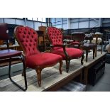 Victorian style open nursing chair in red buttoned upholstery together with similar nursing chair (