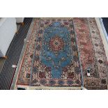 Small Persian style carpet with blue ground and foliate decoration, approx 90 x 175 cm