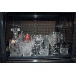 Cage containing tumblers, wine glasses, plus a decanter and silver vodka label