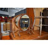 Two early 20th Century walnut framed dressing table mirrors Water damage and wear