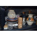 Cage containing a turned onyx vase, various china plates, modern Greek pots, glassware coasters