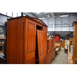 Pine finish bedroom suite comprising triple wardrobe, chest of 8 drawers and a pair of bedside