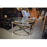 Modern circular glass and metal framed coffee table with four nesting tables under Good condition