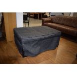 Dark grey fabric ottoman/stowaway bed