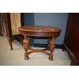 Continental oak oval side table with cup and cover legs Water damage