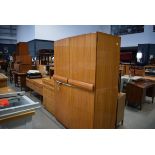 Mid and 20th Century walnut finish bedroom suite comprising a double wardrobe, dressing table and