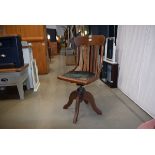 Early 20th century oak swivel office chair with rexine seat In need of attention