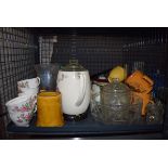 Cage containing commemorative mugs, glass, bowls, vases, a mantel clock, various jugs and