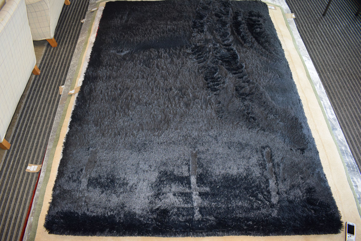 Modern black shagpile type carpet, approx 165 x 235cm