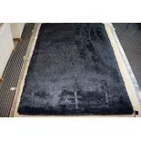 Modern black shagpile type carpet, approx 165 x 235cm
