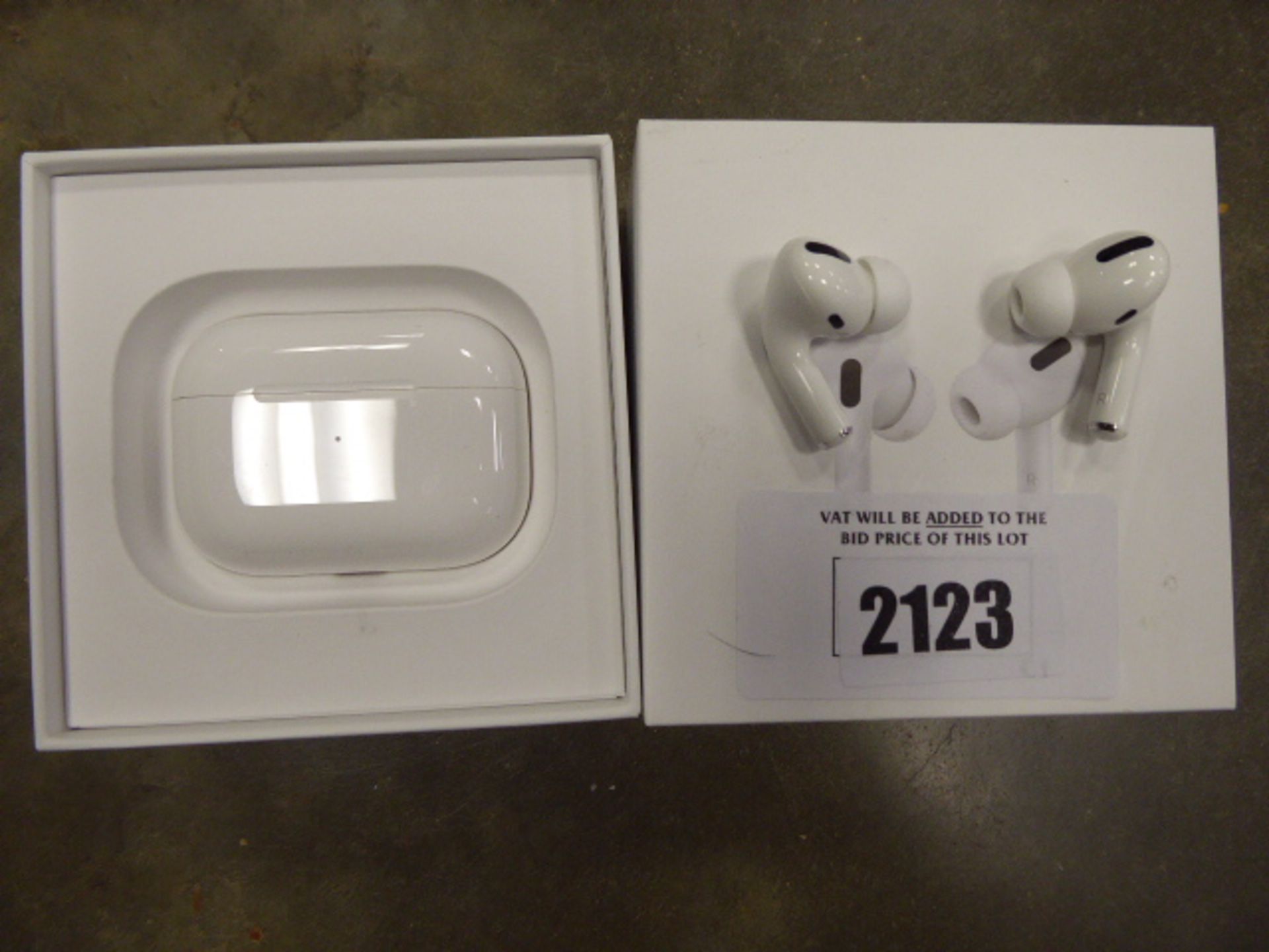 Pair of Apple AirPods with wireless charging case and box