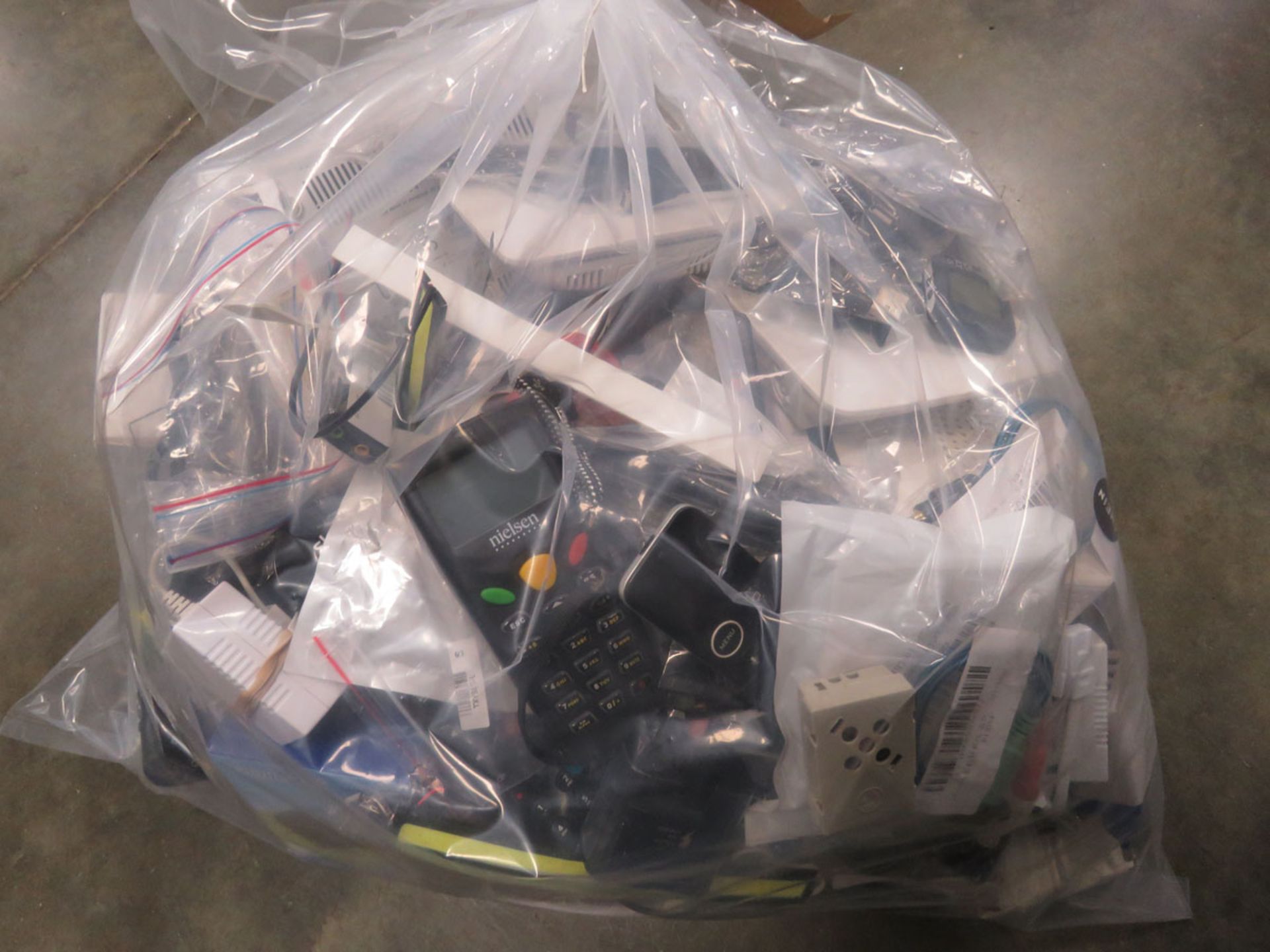 Bag containing quantity of electrical devices/accessories; mice, routers, adapters, boards, chips