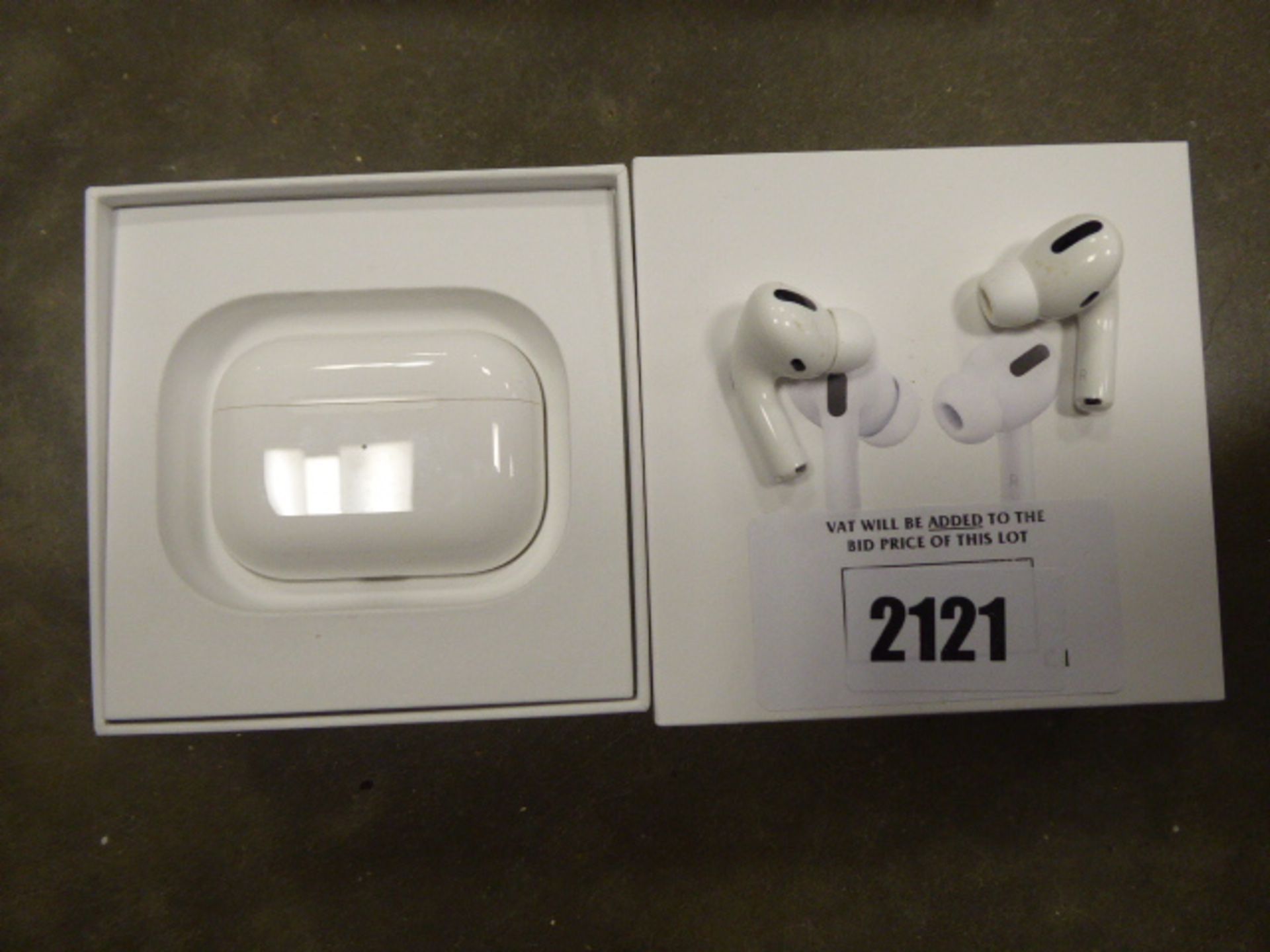 Pair of Apple AirPods with wireless charging case and box
