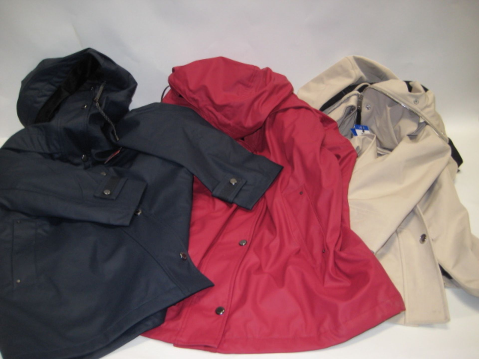 Three light weight ladies coats with hoods, 2 by Weatherproof and by DKNY sizes range from M-L