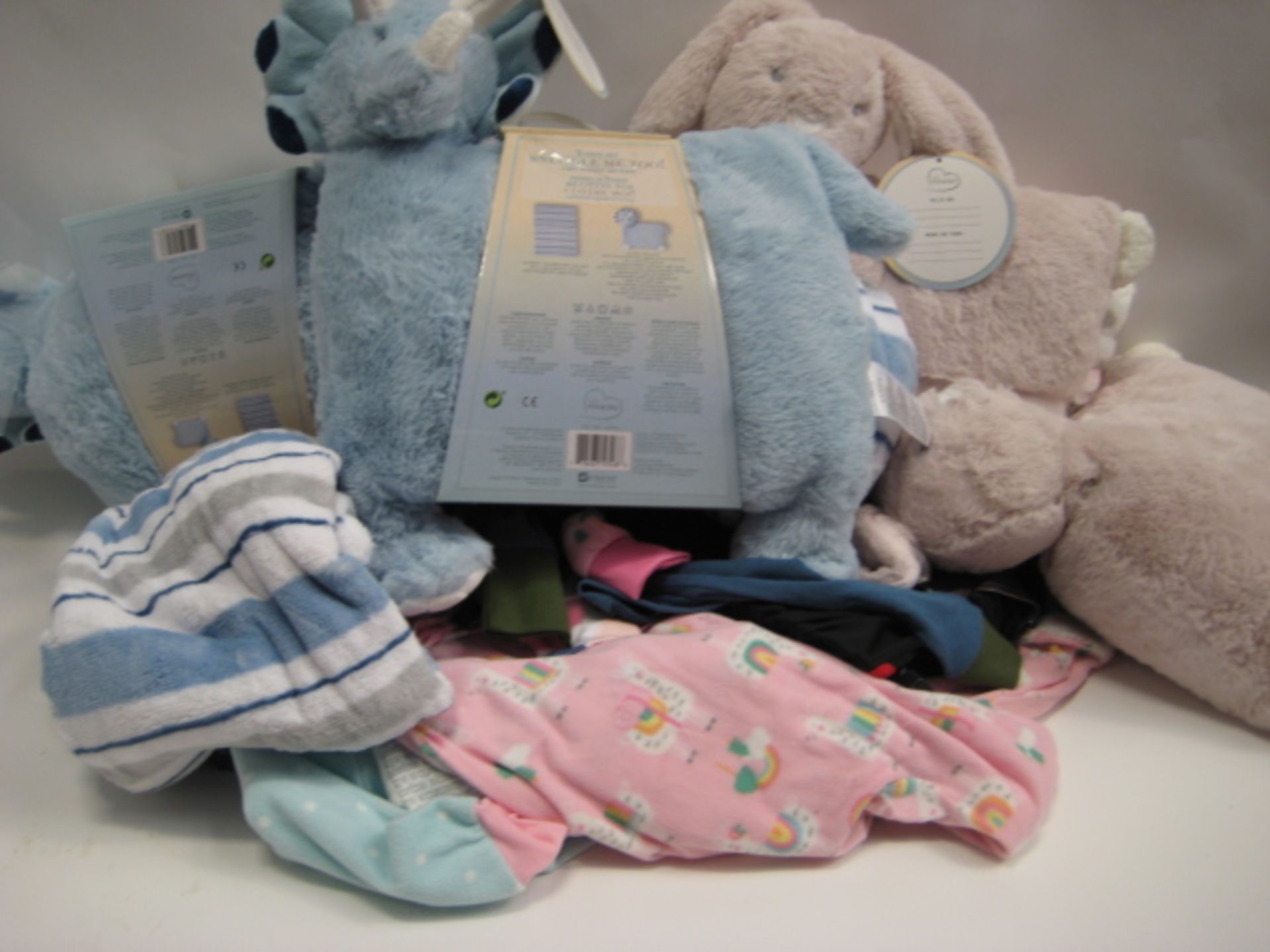 Two bags containing children's clothing together with children's 2 piece Snuggle Me 2 comfort