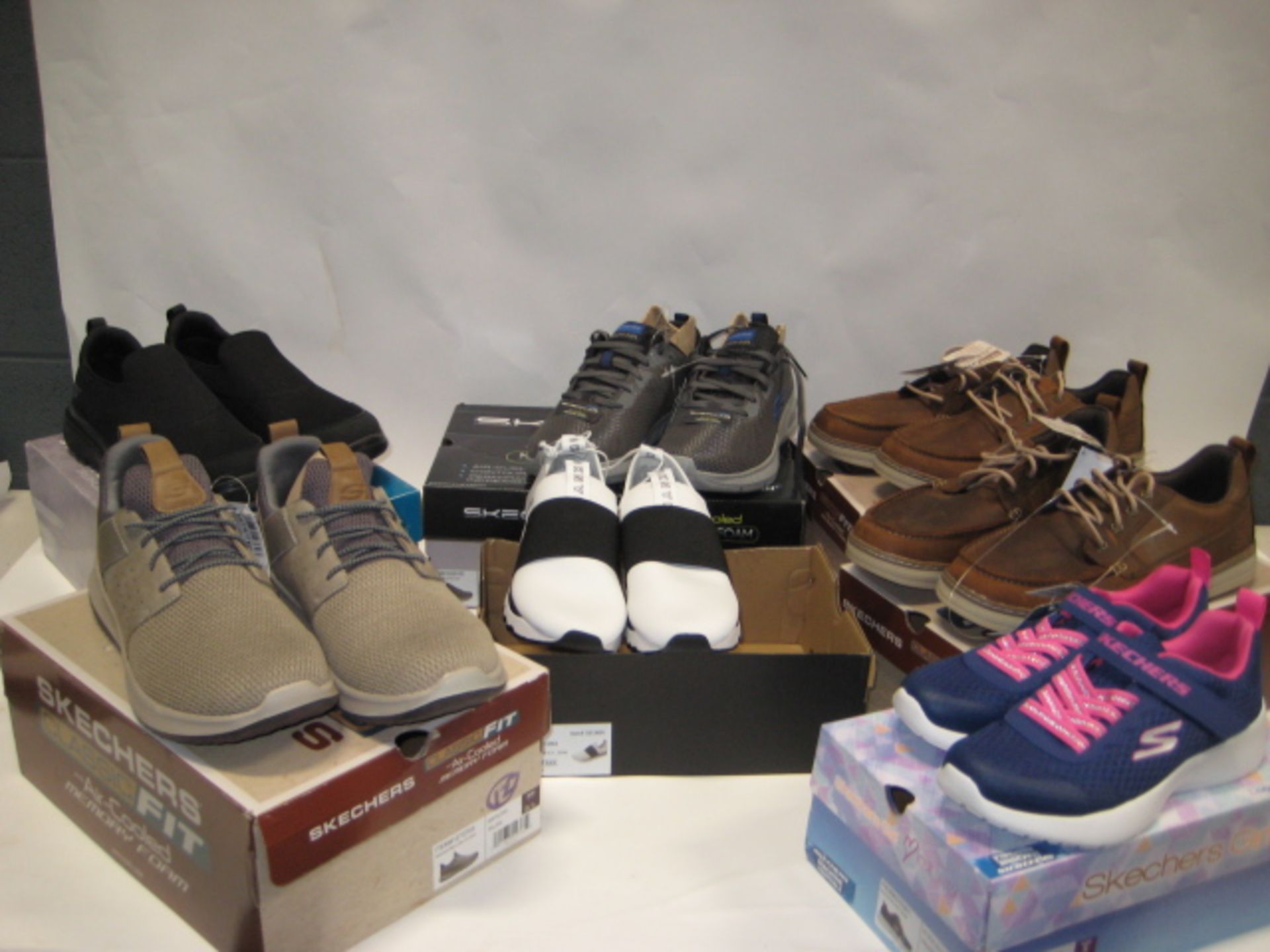 Seven boxed pairs of ladies and gents shoes and trainers by Sketchers, DKNY sizes ranging from