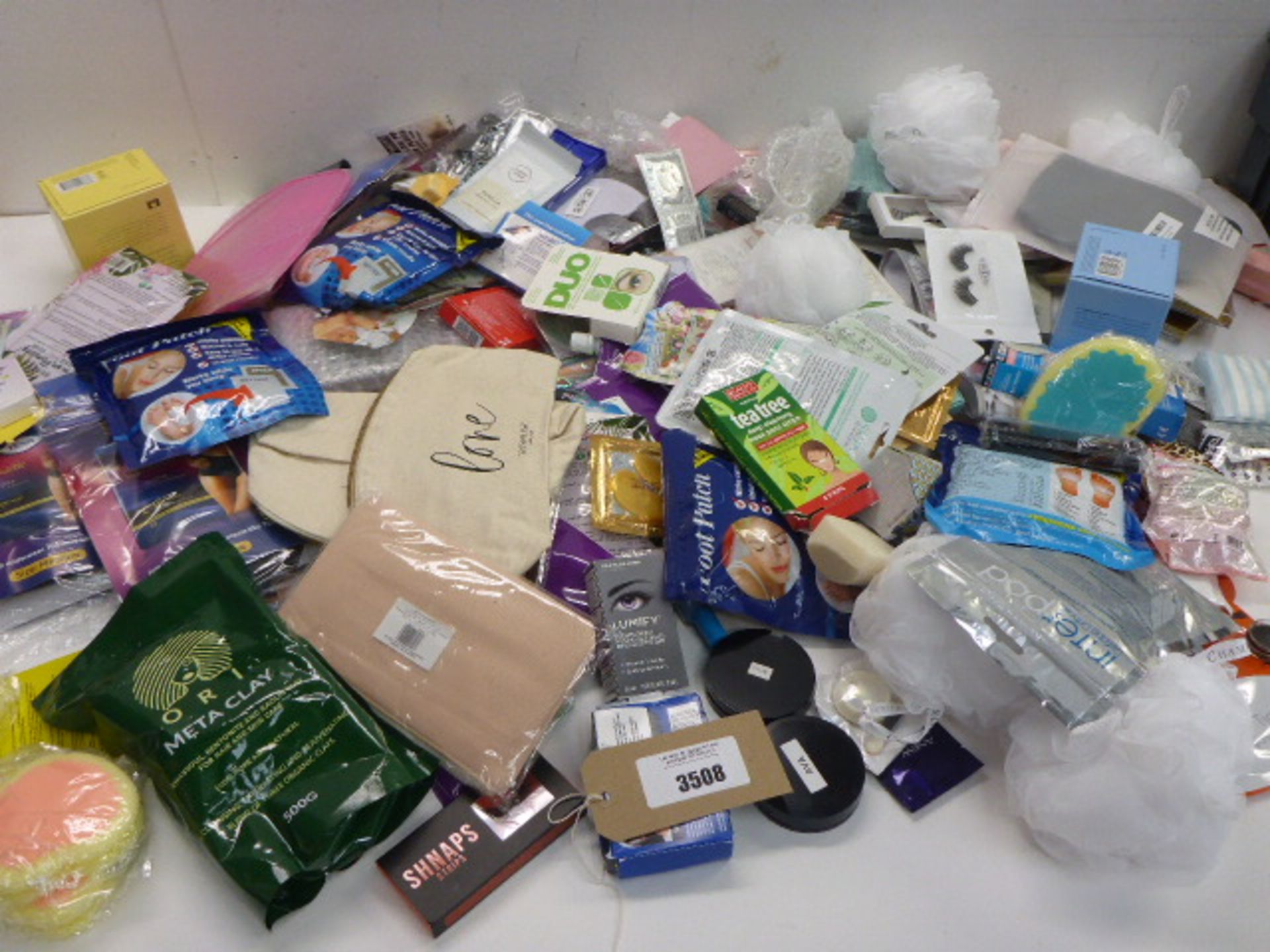 Large bag of beauty products including false eyelashes, false nails & nail art, face & feet masks,