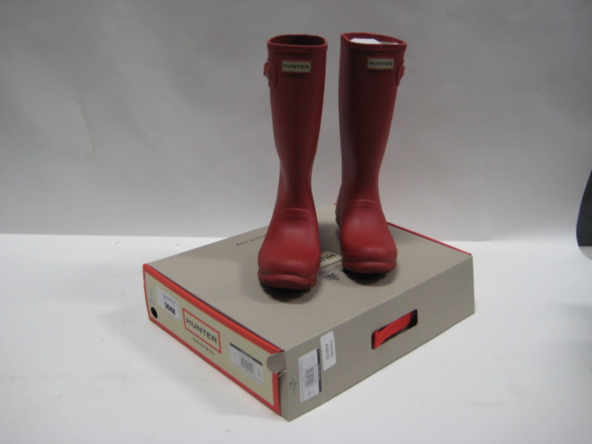 Boxed pair of Hunter Original wellingtons in red, size UK4