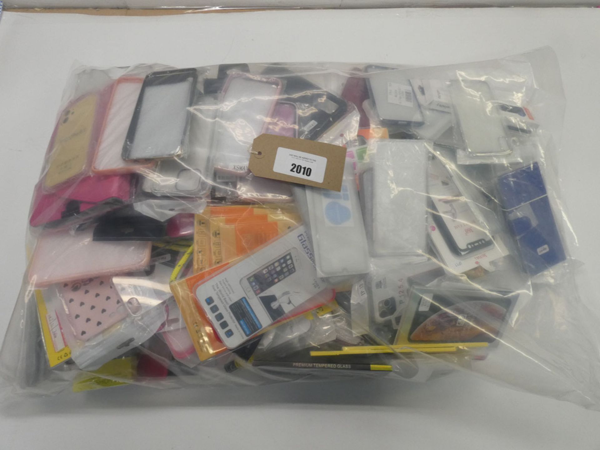 Bag containing quantity of mobile phone cases and covers