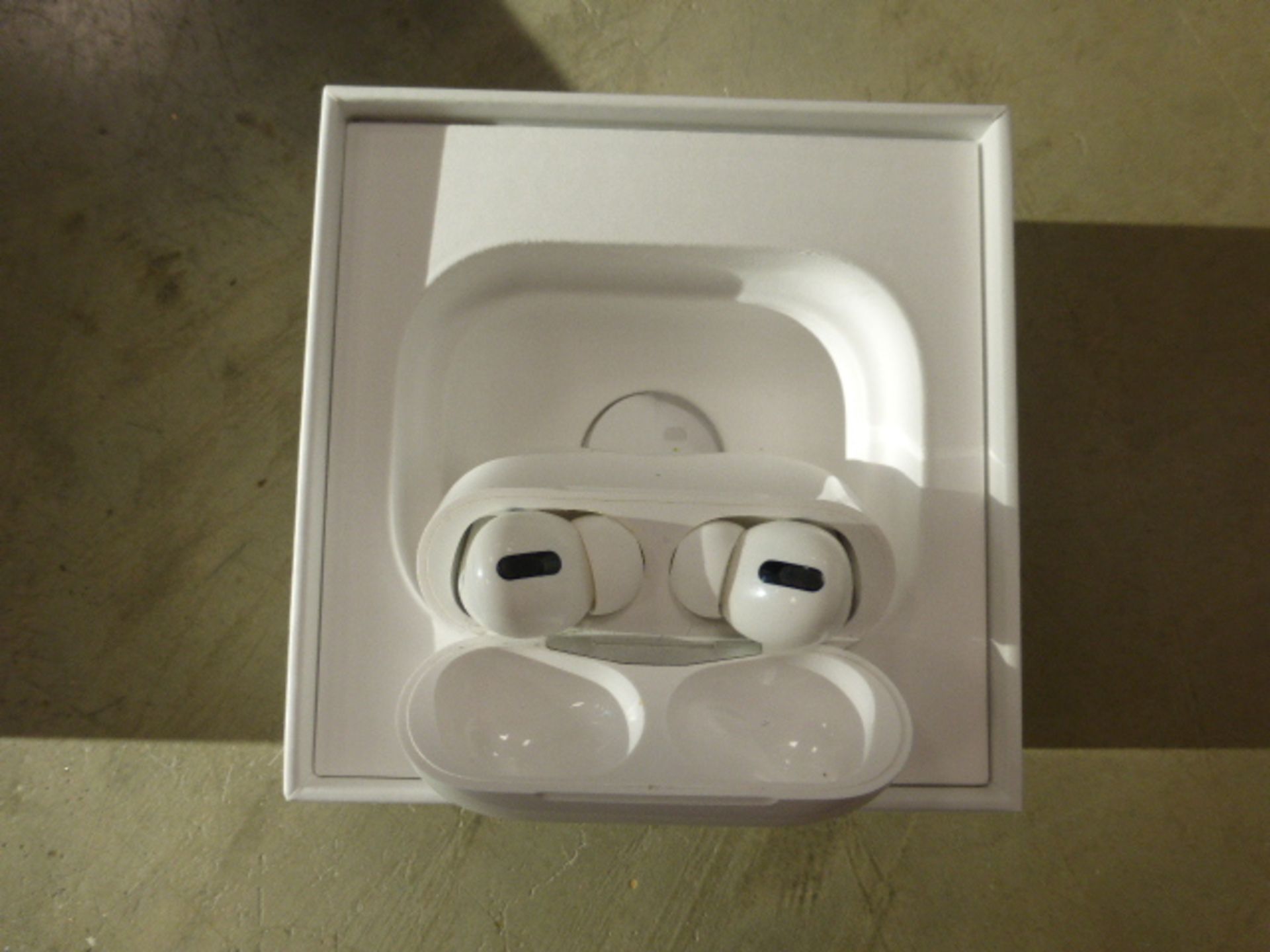 Apple AirPods Pro with wireless charging case and box