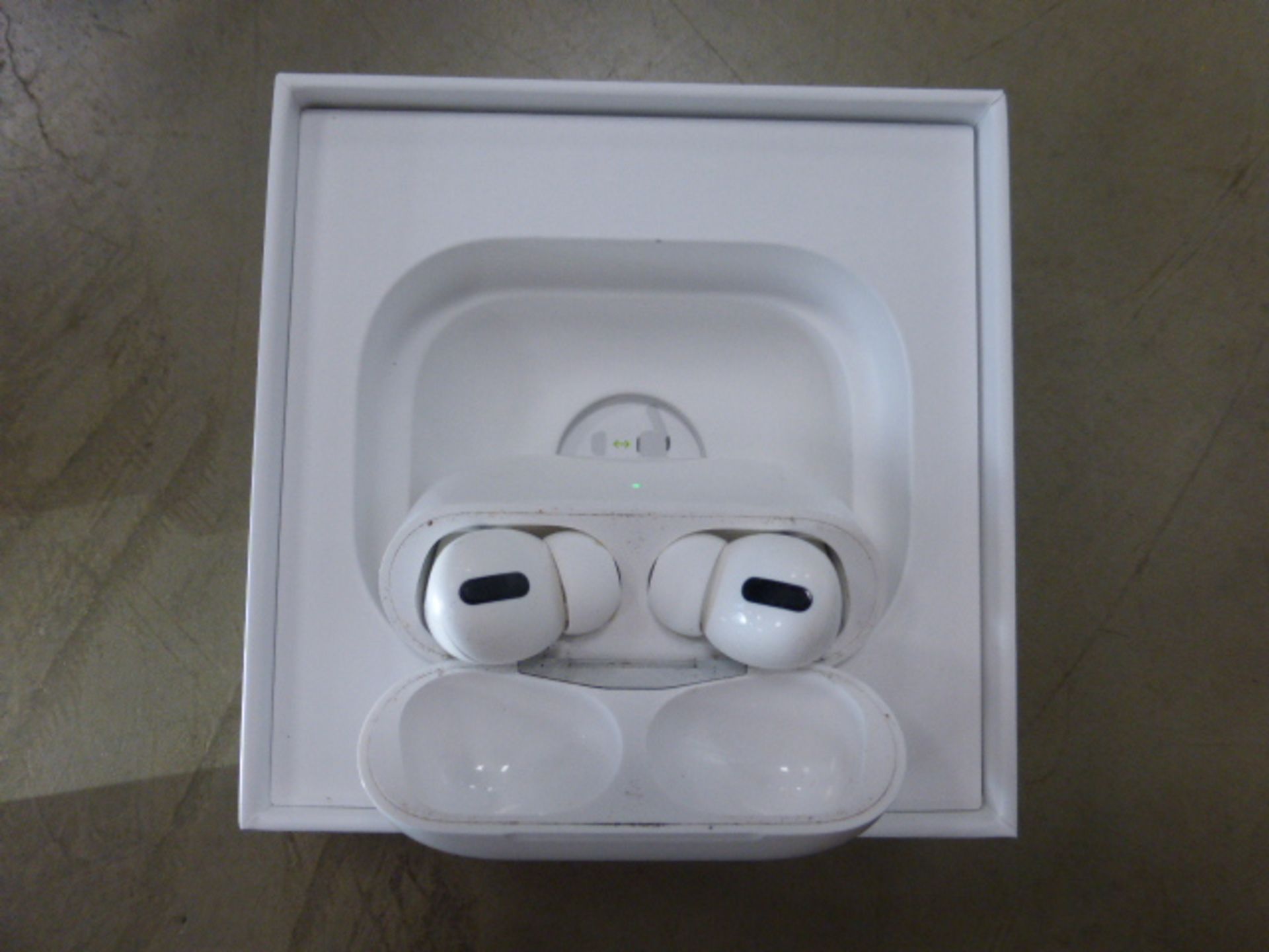 Apple AirPods Pro with wireless charging case and box