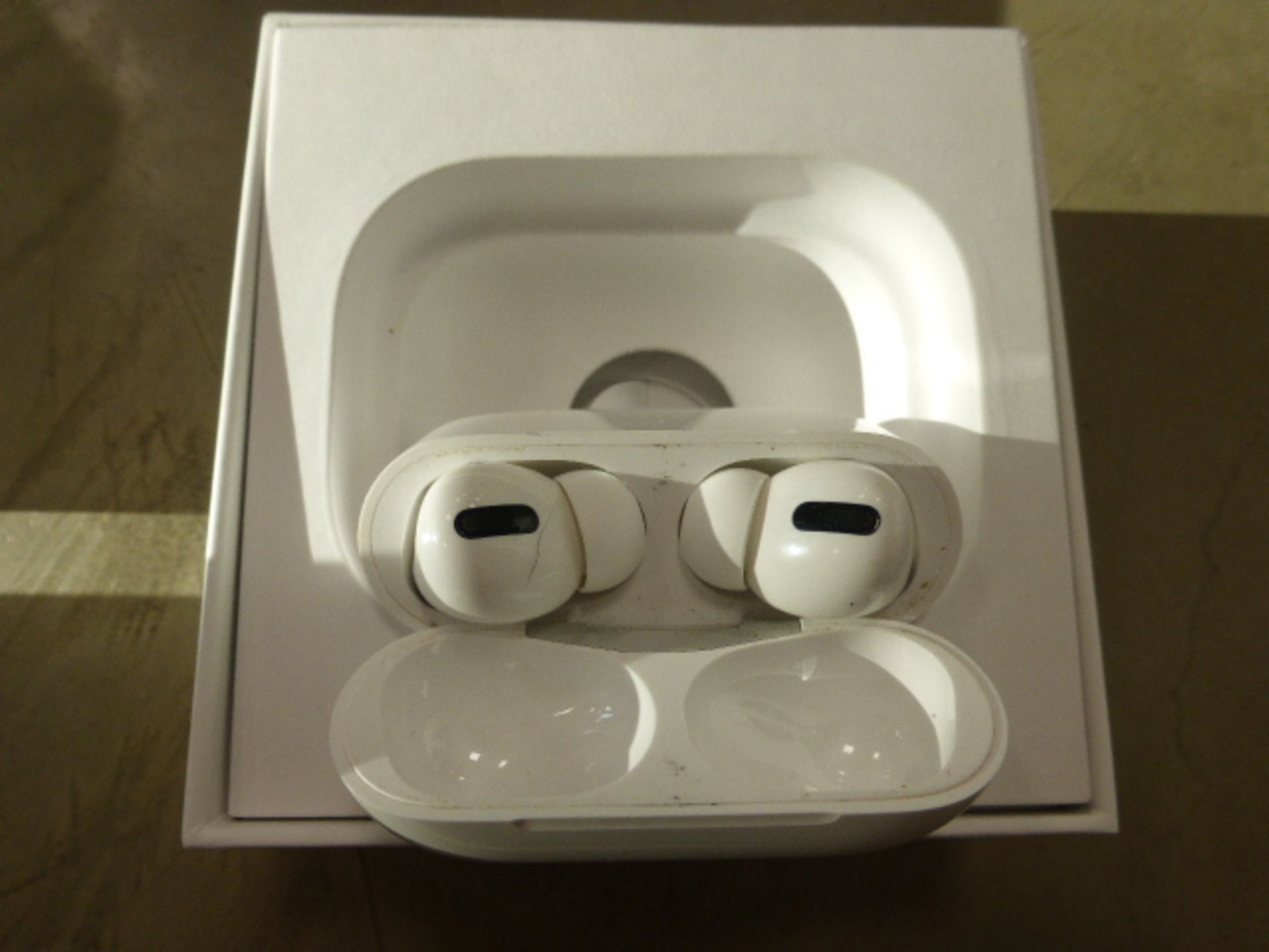 Apple AirPods Pro with wireless charging case and box