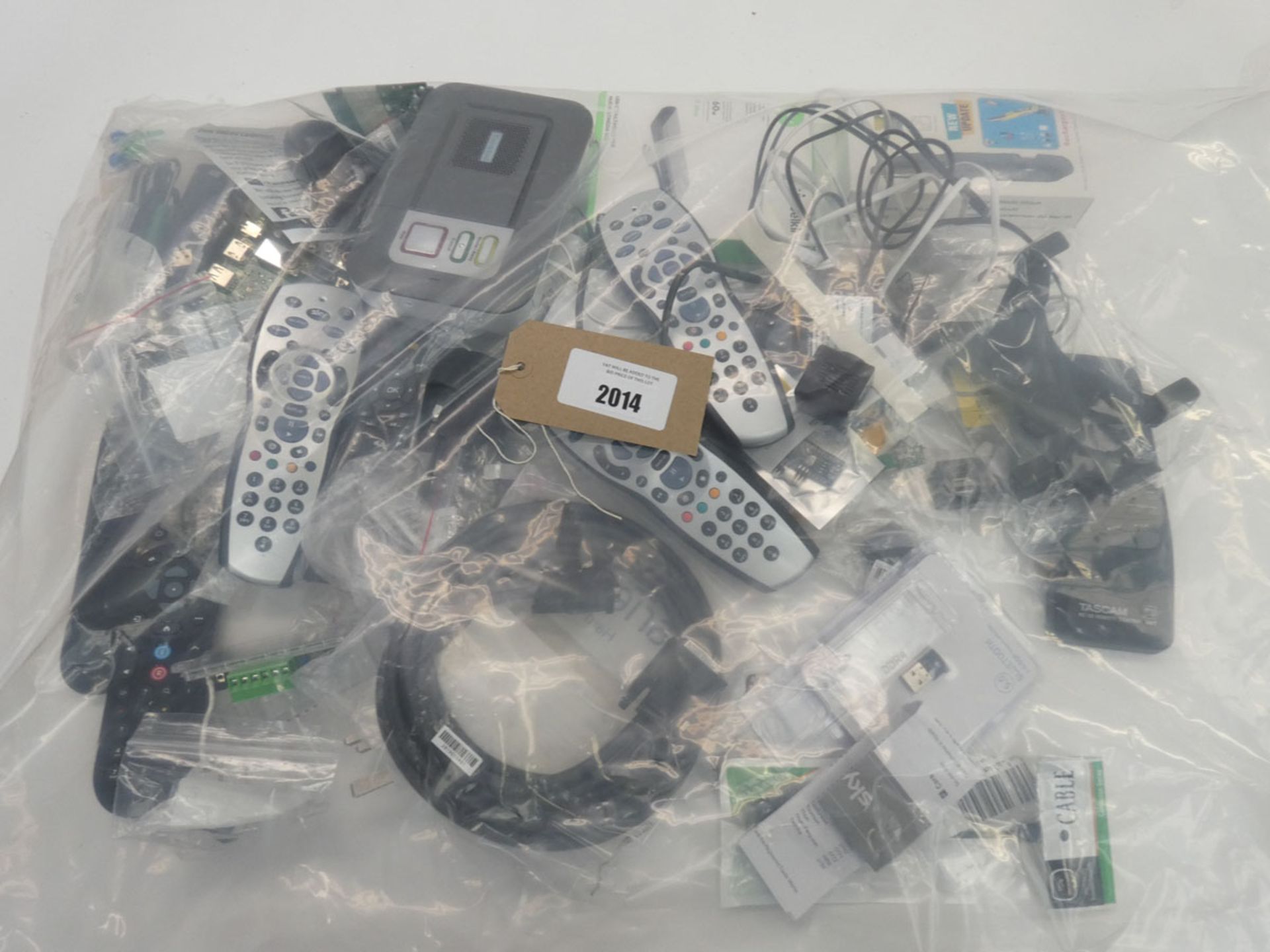 Bag containing remote controls, Tunstall Lifeline Vi/Vi+ telecare unit, adapters, mice etc