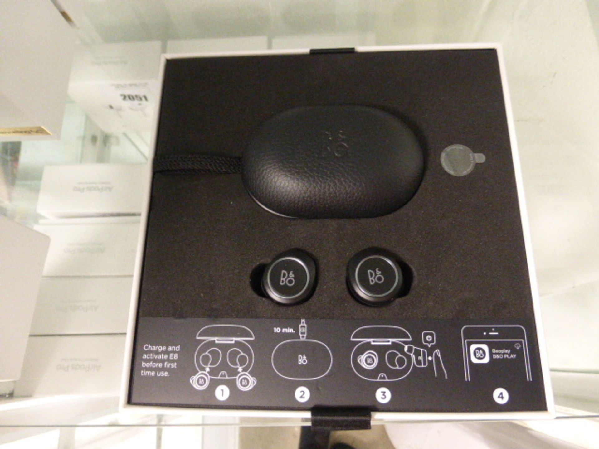Set of Bang & Olufsen E8 wireless earphones with charging case and box
