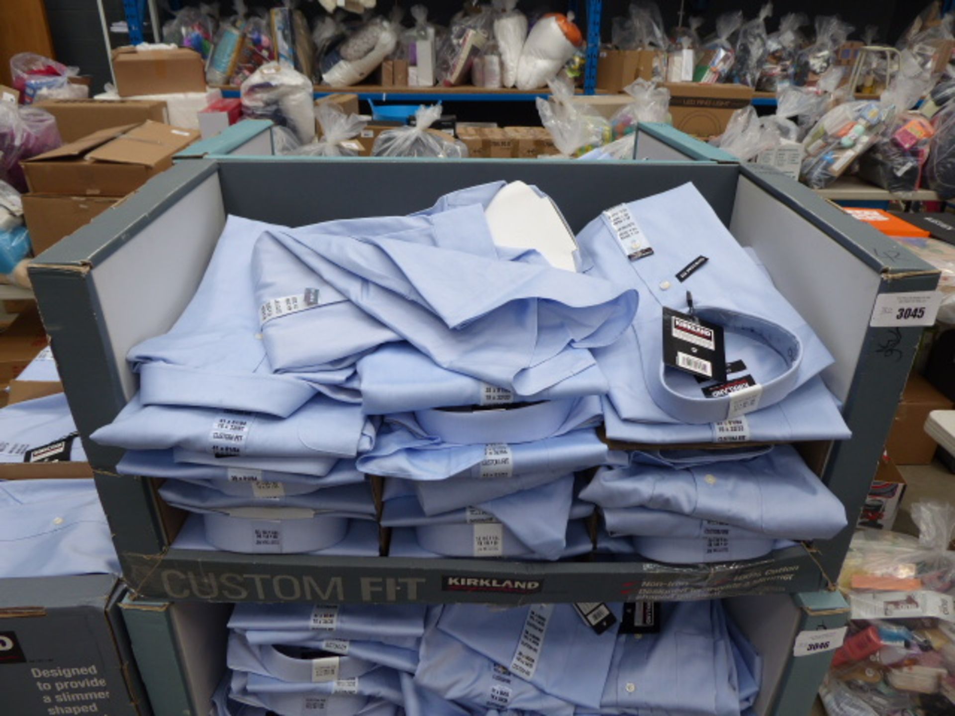 Tray containing approx 32 men's Kirkland custom fit shirts in light blue