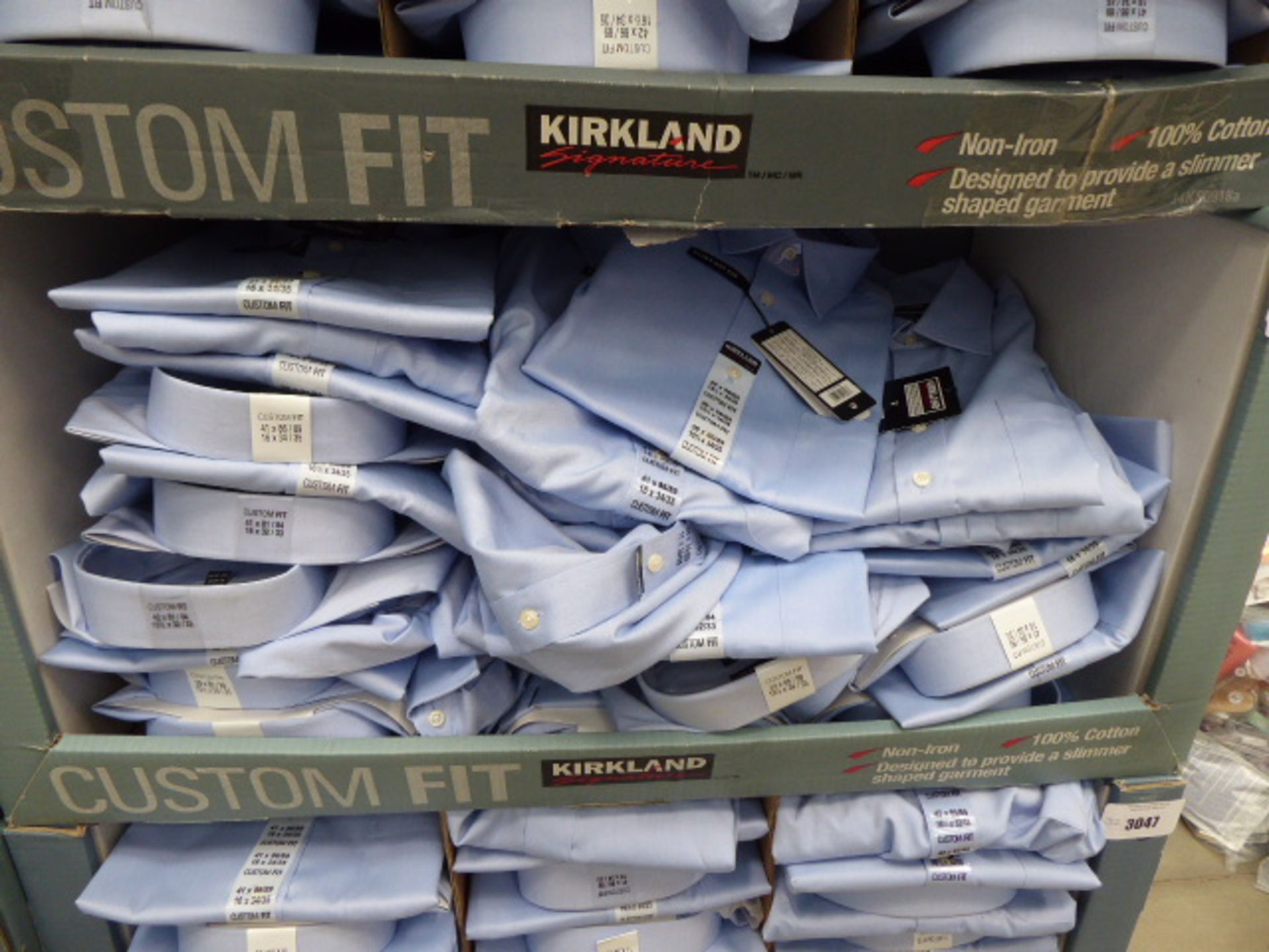 Tray containing approx 32 men's Kirkland custom fit shirts in light blue