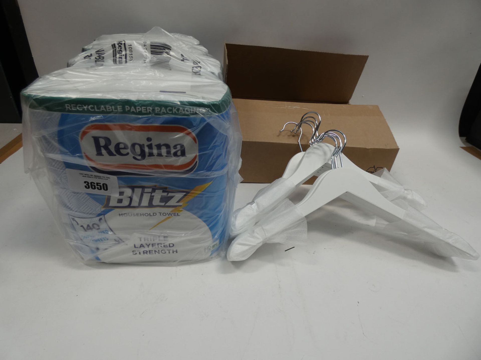4 packs of Regina Blitz household towels and box of ten white coat hangers