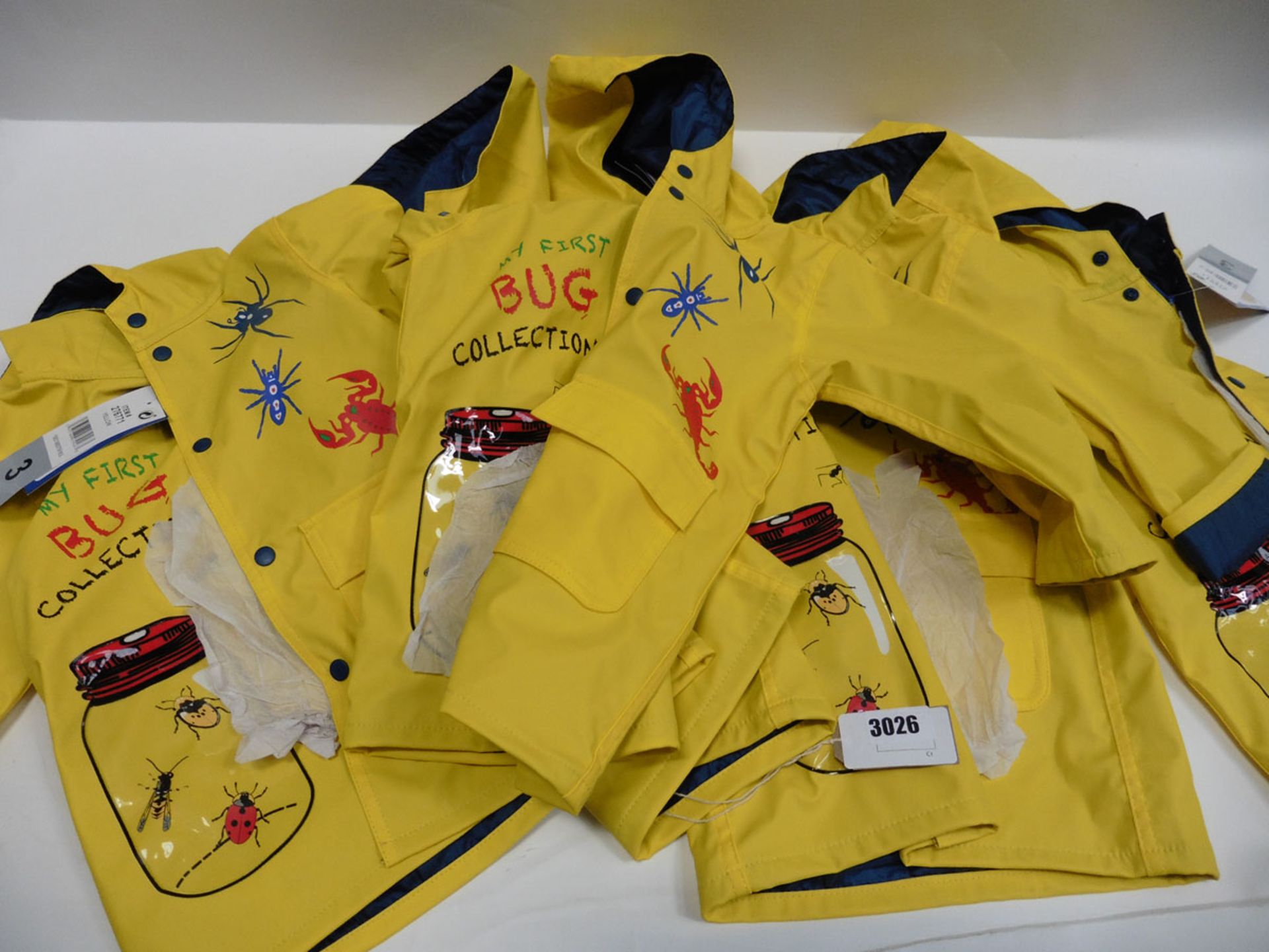 Five children's boys yellow rain coats