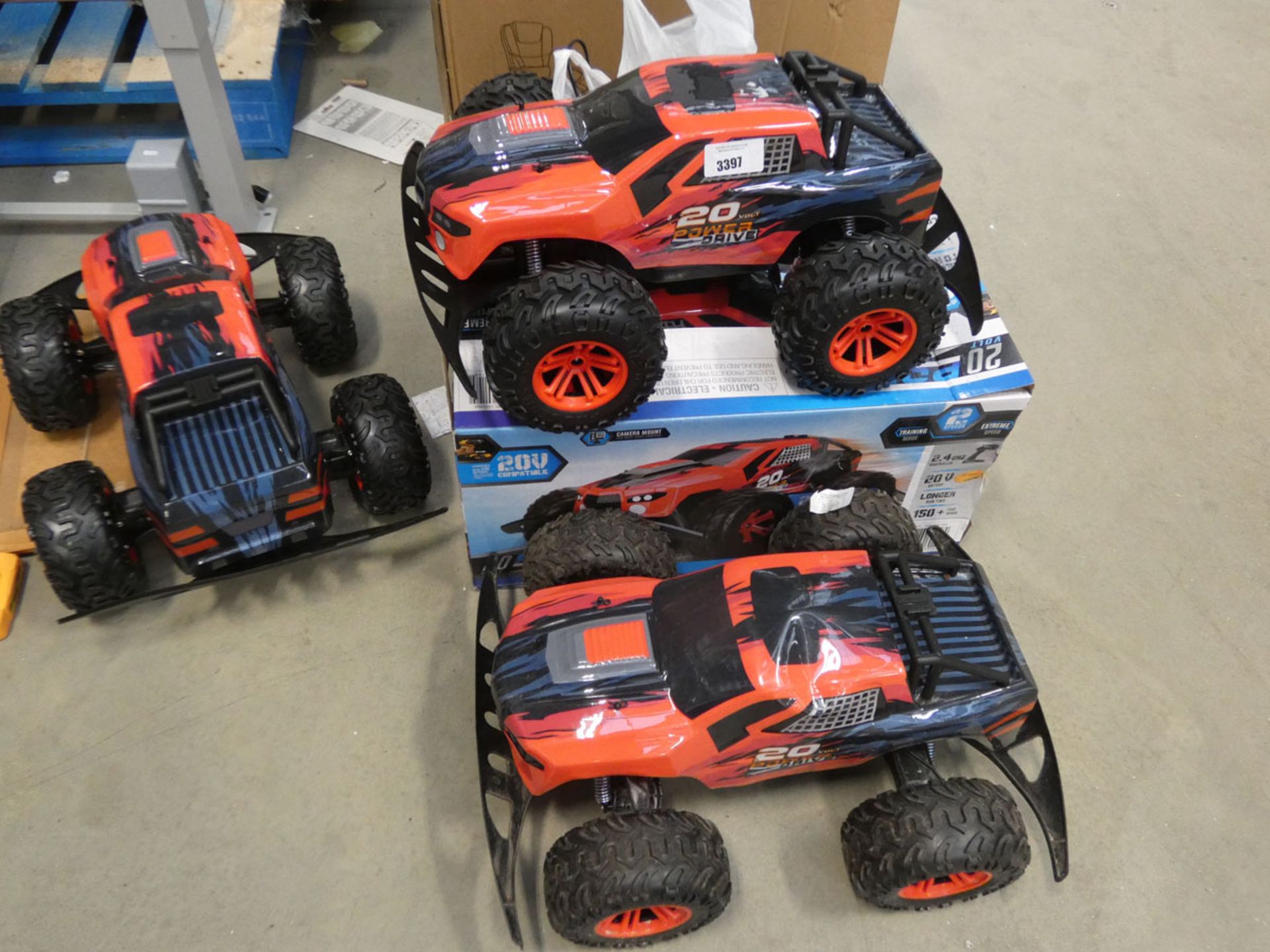 3369 - 3 unboxed monster trucks plus 1 boxed with remotes